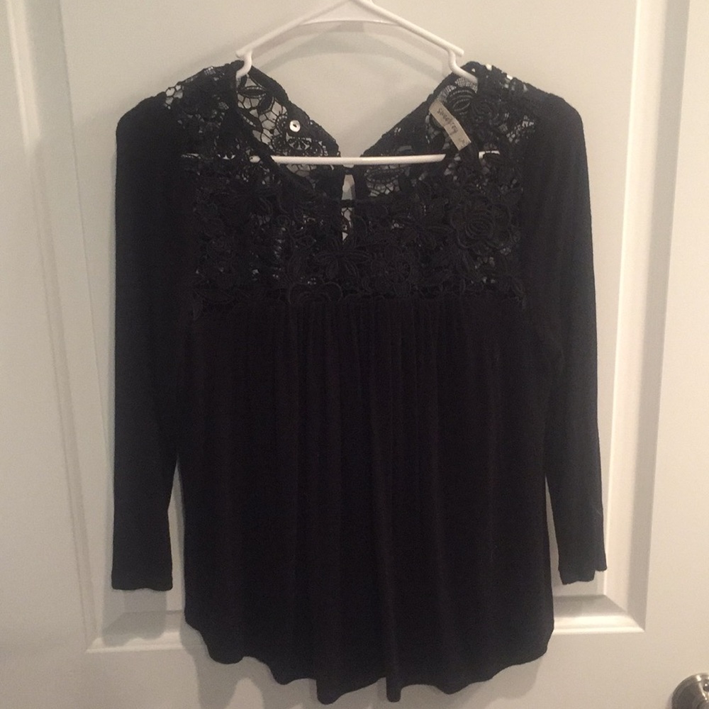 Cute black top with islet detail.